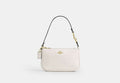 Coach Nolita 19 in refined pebble leather in Gold/Chalk