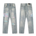 Amiri Light Wash Pastel Logo Jeans