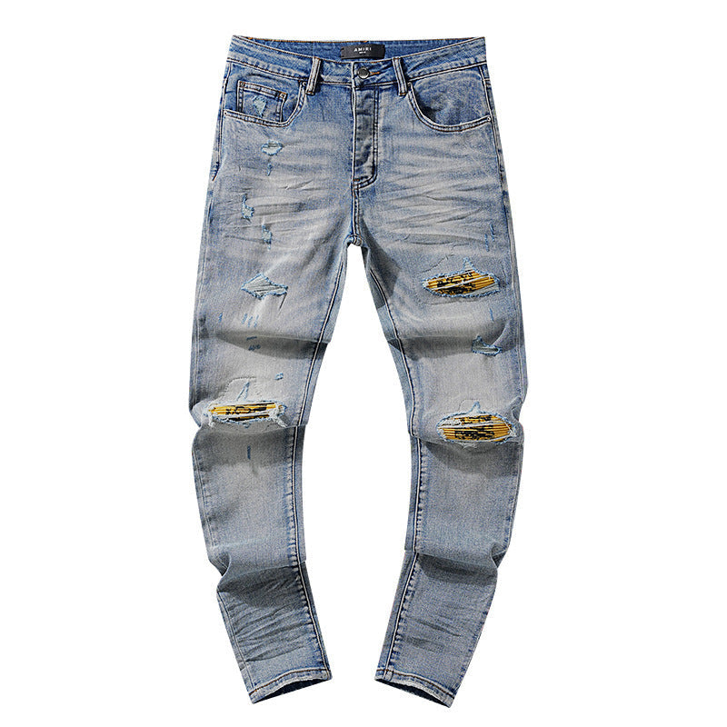 Amiri Yellow-Underlay Distressed Light-Wash Jeans